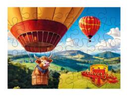 Puzzle 100 pi&egrave;ces souvenir Auvergne illustr&eacute; d'une vache en montgolfi&egrave;re