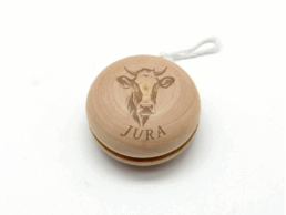 Yoyo en bois souvenir Jura grav&eacute; d'une vache et du nom Jura