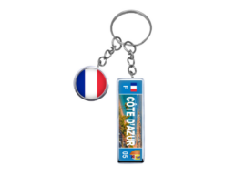 Porte-cl&eacute;s rond et plaque souvenir C&ocirc;te d'Azur avec panorama m&eacute;diterran&eacute;en